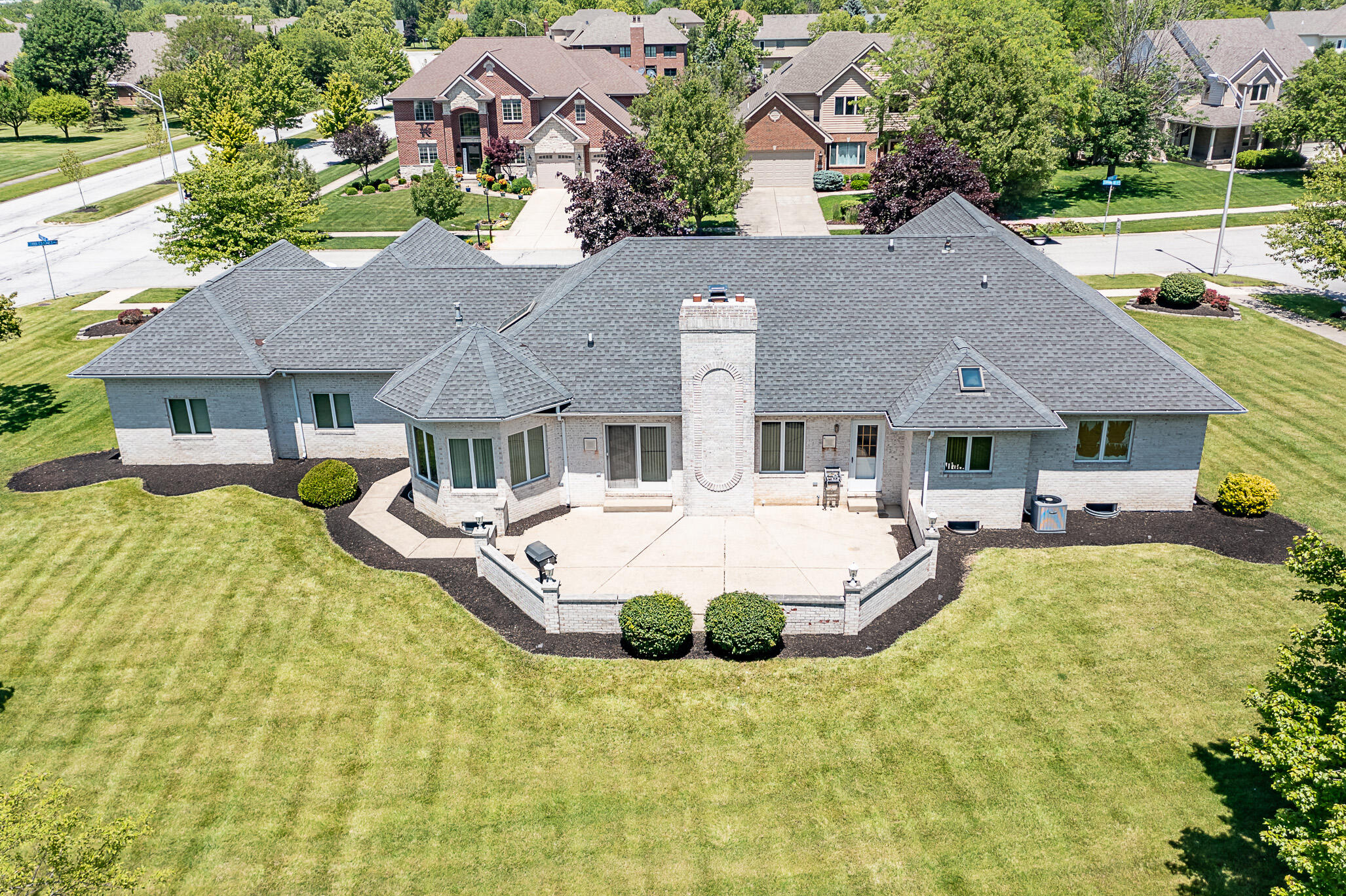 1020 Cornwallis Lane Munster, IN 46321 - Photo 4 of 41 a front view of a house with swimming pool and porch