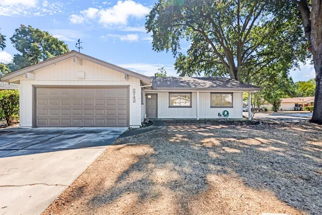 front view of a house with a yard