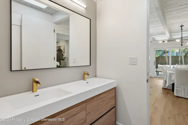 a bedroom with a large bed couch and a window