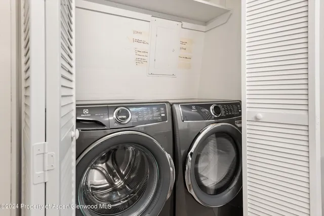 a bathroom with double vanity sinks and a mirror