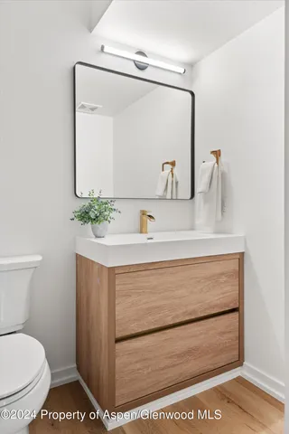 a bedroom with two beds and a window