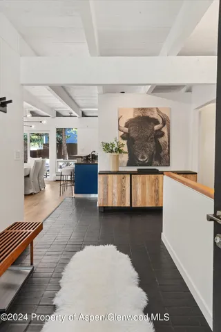 a living room with furniture and a rug