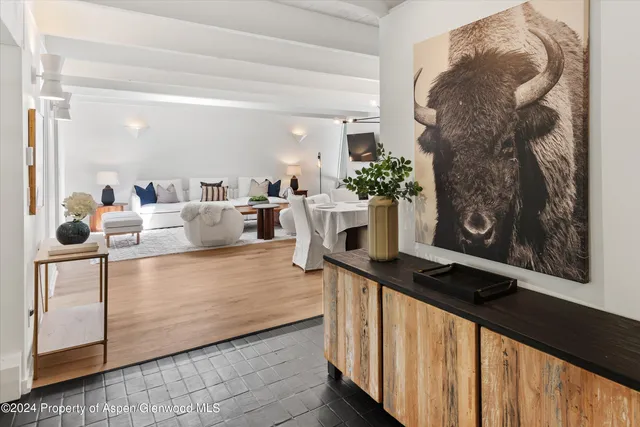a view of living room filled with furniture and wooden floor