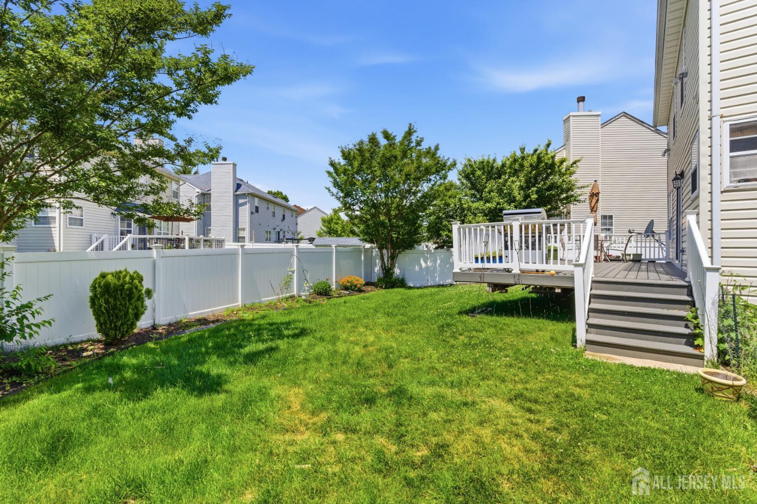 26 Alexis Lane Edison, NJ 08820 - Photo 36 of 39 a view of a house with backyard and a garden