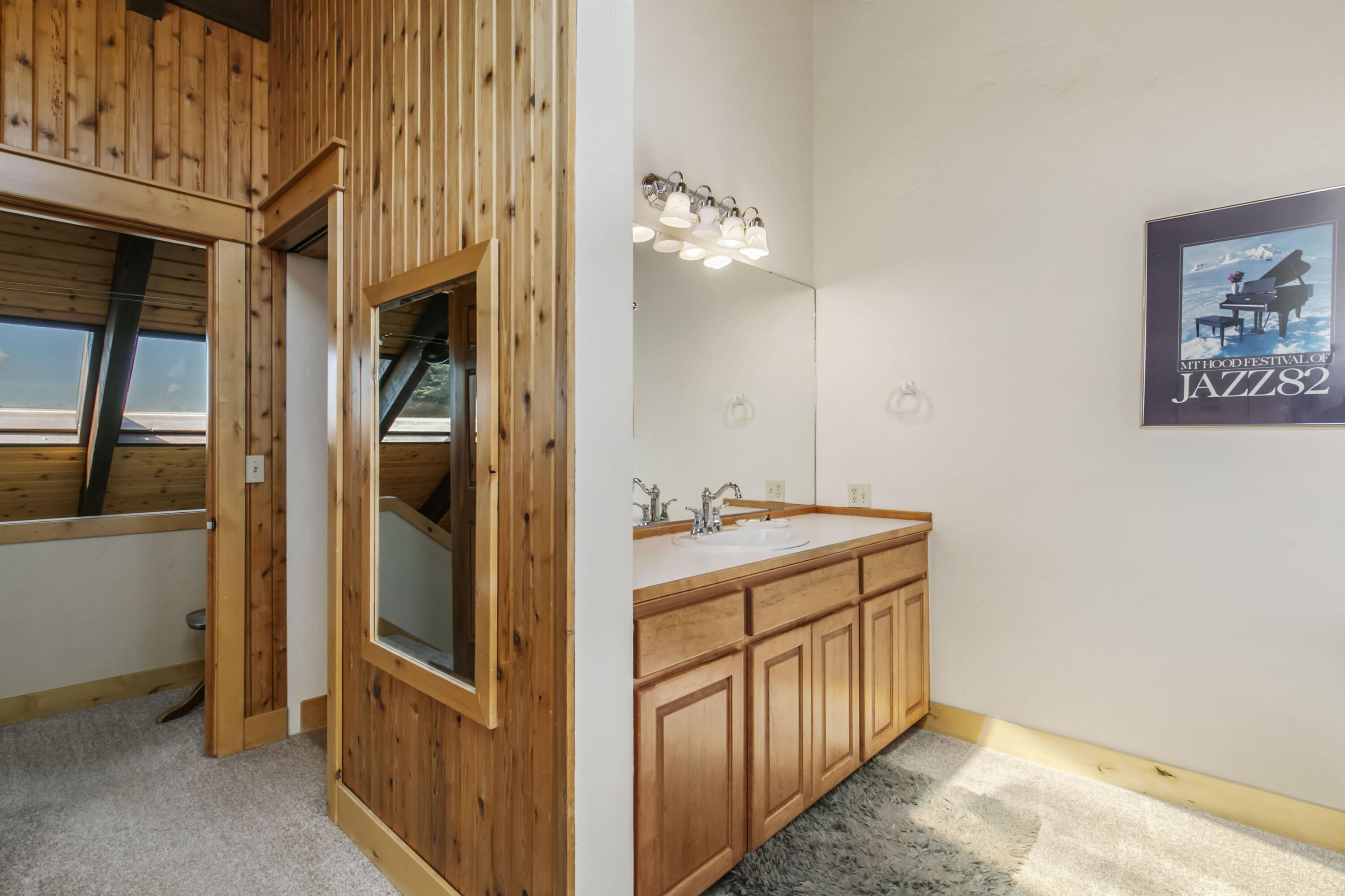 20155 Marsh Road Bend, OR 97703 - Photo 15 of 39 a bathroom with a double vanity sink and a mirror