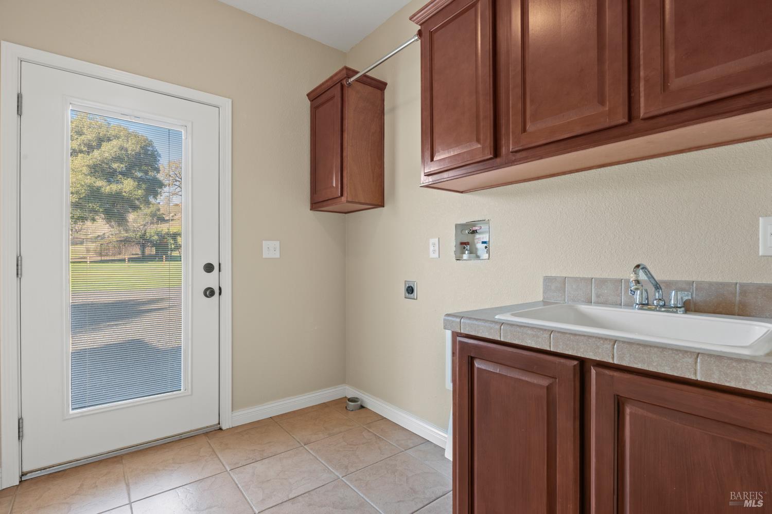 4595-4601 Feliz Creek Road Hopland, CA 95449 - Photo 43 of 74 Laundry area with sink an cabinets in Modular home