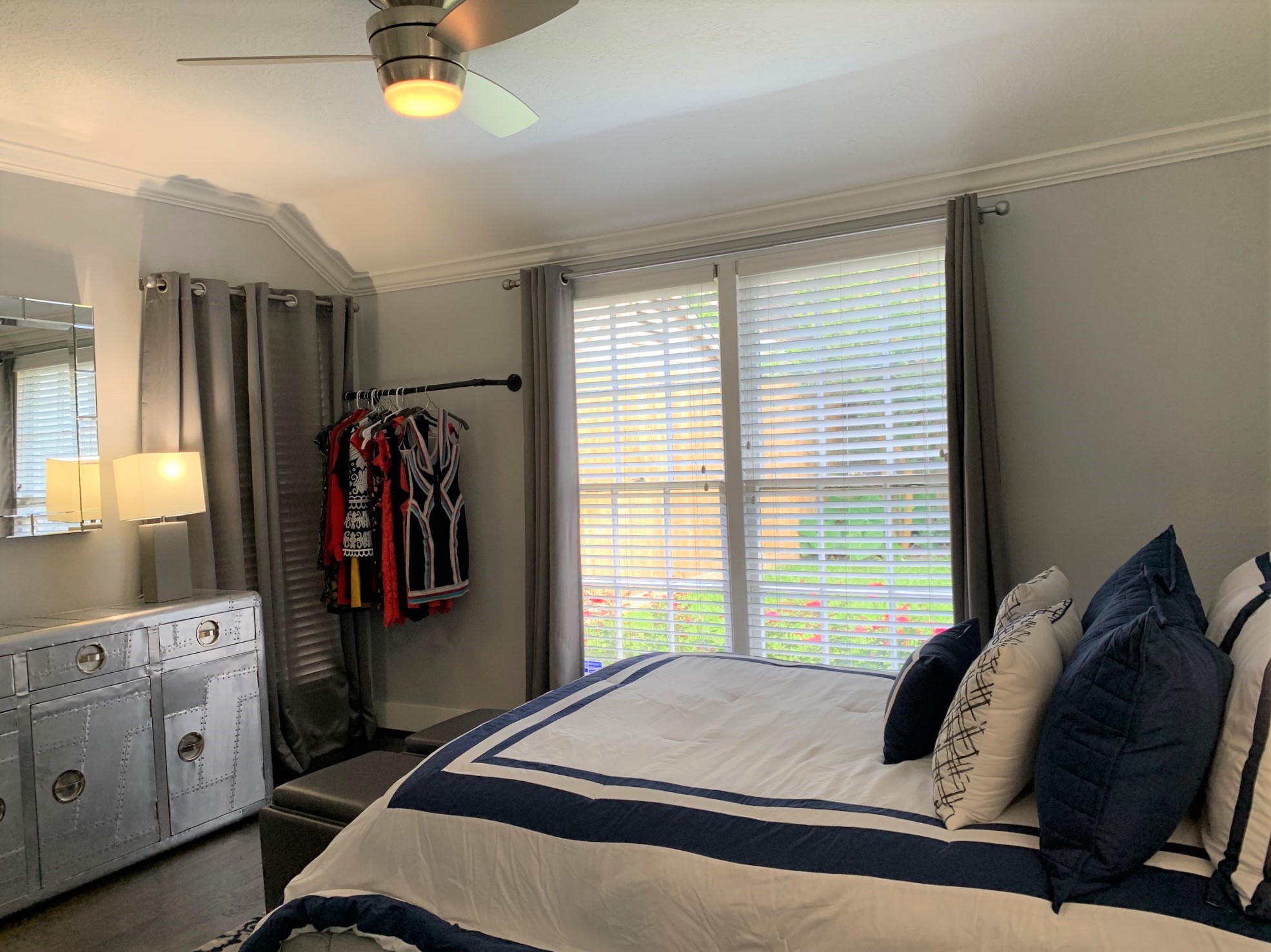 3909 Rice Boulevard Houston, TX 77005 - Photo 12 of 17 a bedroom with a bed and a window