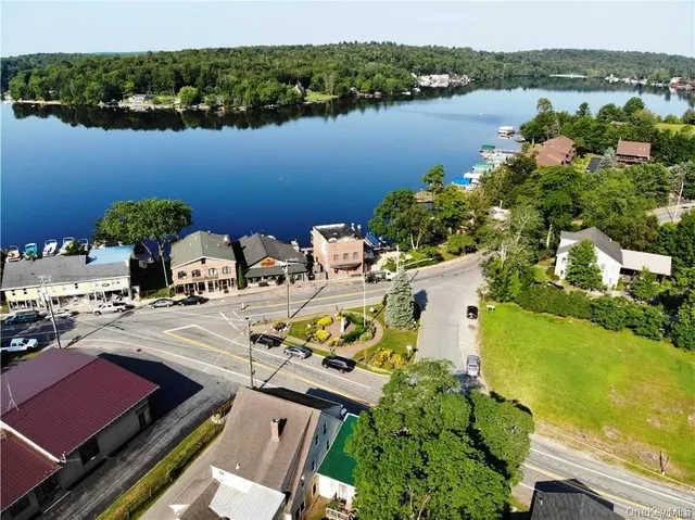 an aerial view of a house with lake view