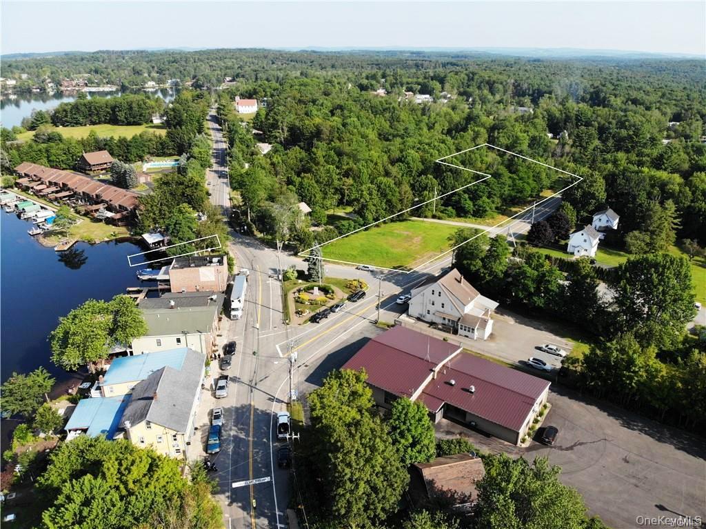 Lot 18 Horseshoe Lake Road Kauneonga Lake, NY 12749 - Photo 7 of 24 an aerial view of a house with a garden