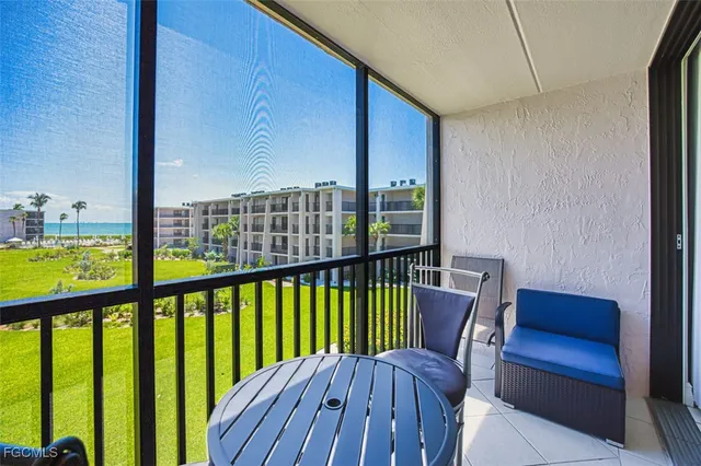 a view of a balcony with chairs