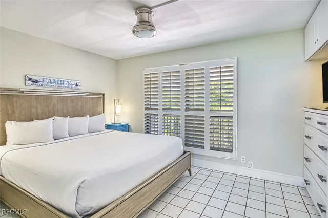 a view of a hallway with table and chairs