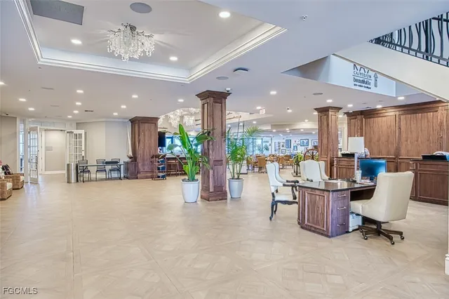 a lobby with furniture and stairs