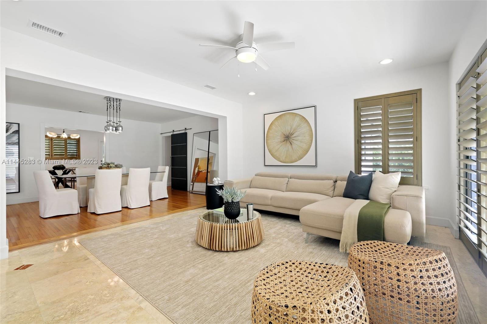3411 Riviera Drive Coral Gables, FL 33134 - Photo 11 of 38 a living room with furniture ceiling fan and a window