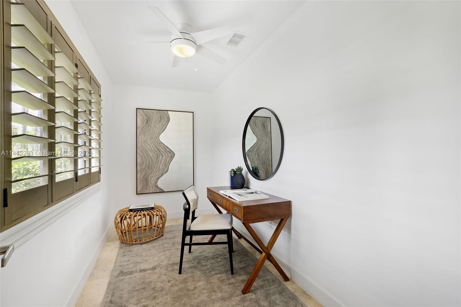 3411 Riviera Drive Coral Gables, FL 33134 - Photo 13 of 38 a living room with furniture a window and a potted plant
