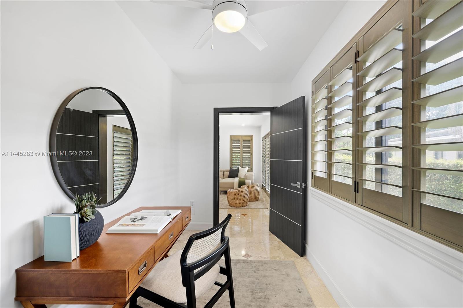 3411 Riviera Drive Coral Gables, FL 33134 - Photo 14 of 38 a view of a livingroom with furniture and windows