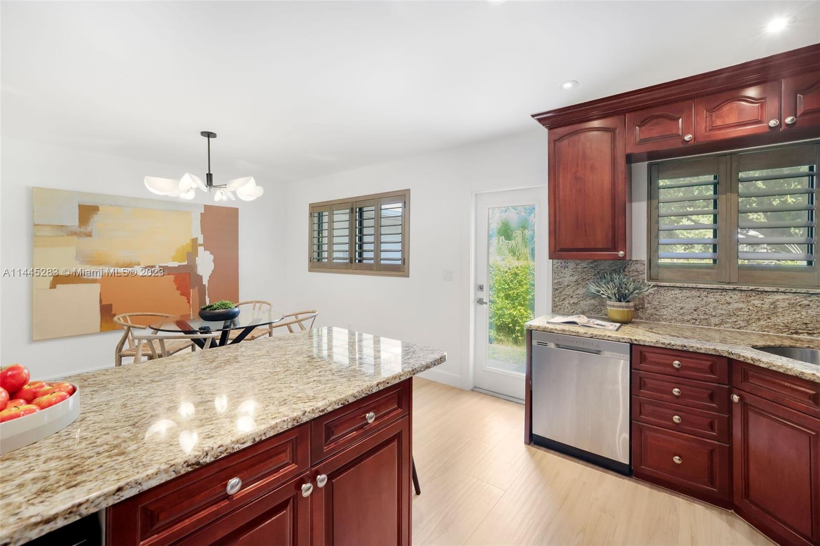 3411 Riviera Drive Coral Gables, FL 33134 - Photo 20 of 38 a kitchen with a sink cabinets and window