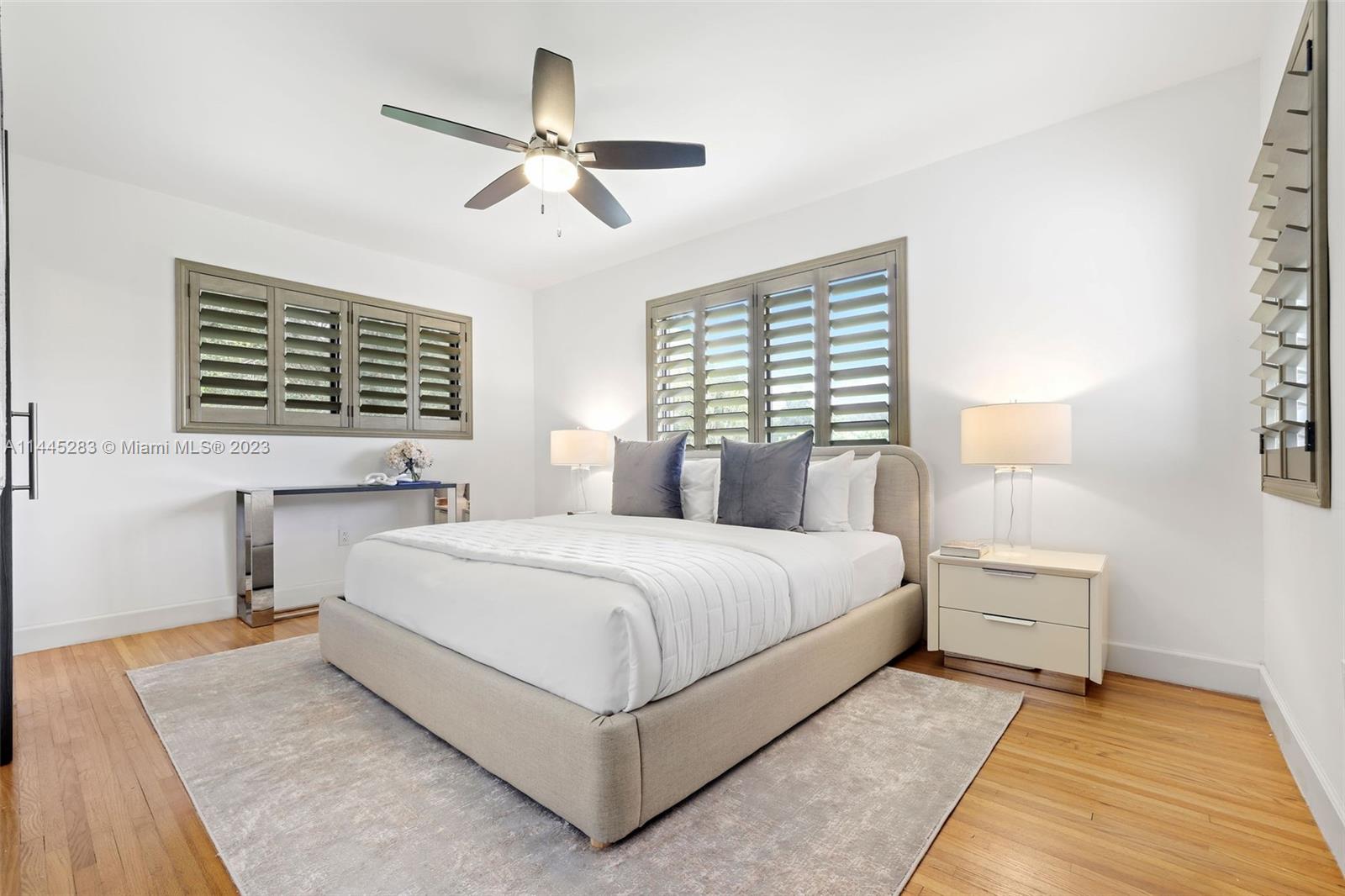 3411 Riviera Drive Coral Gables, FL 33134 - Photo 21 of 38 a bedroom with a large bed and a window