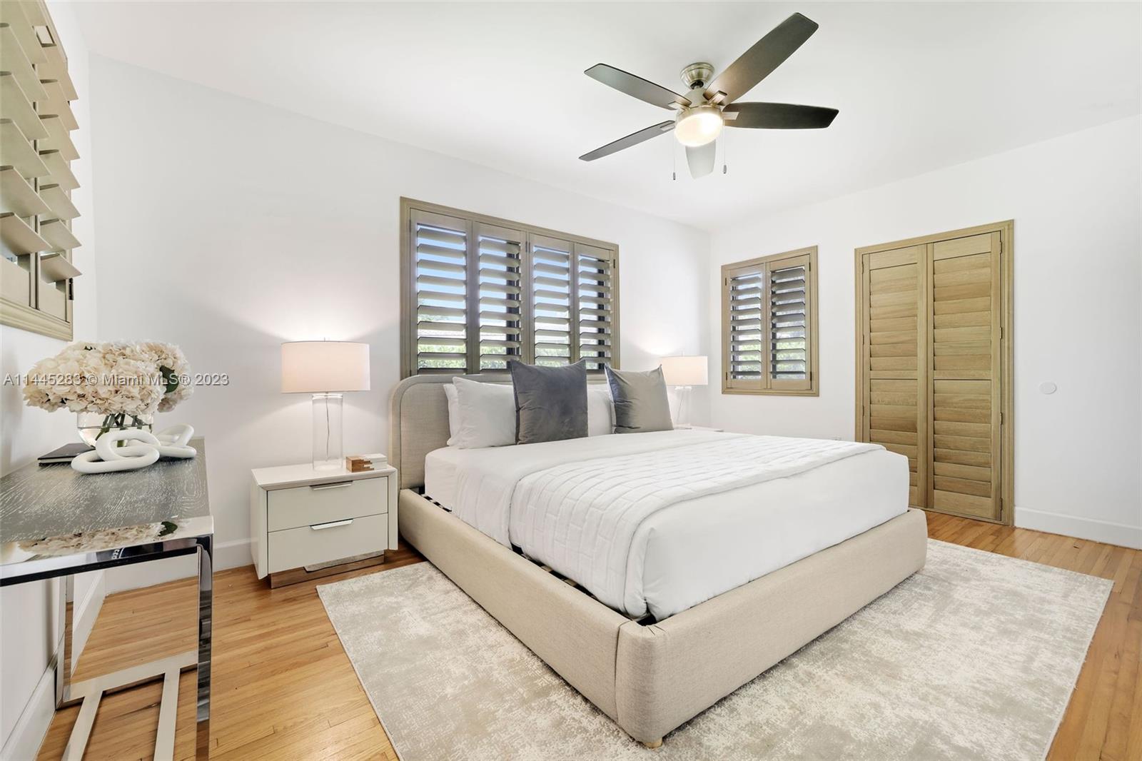 3411 Riviera Drive Coral Gables, FL 33134 - Photo 24 of 38 a bedroom with a large bed and a window