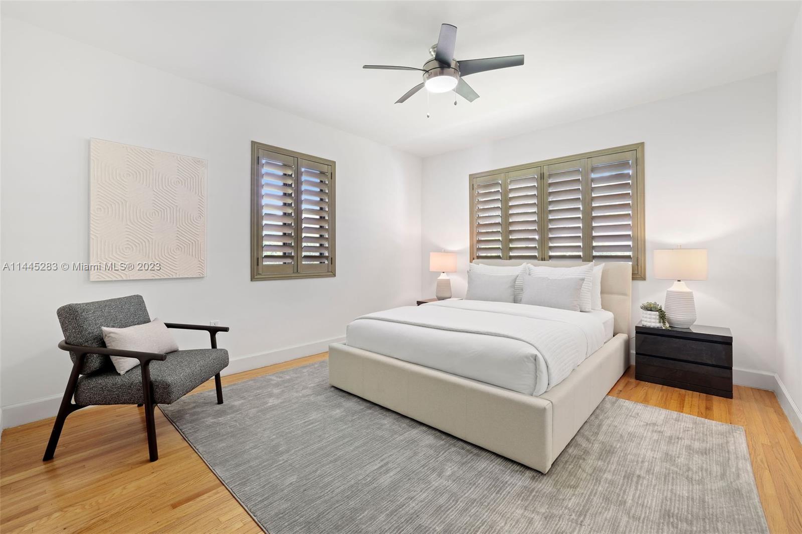 3411 Riviera Drive Coral Gables, FL 33134 - Photo 28 of 38 a bedroom with a bed and chair