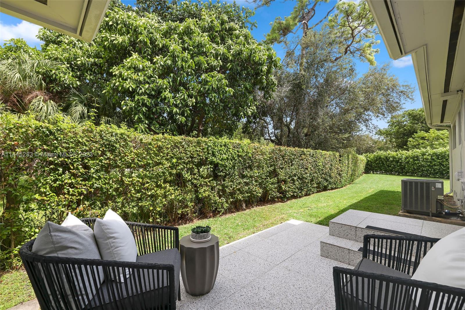 3411 Riviera Drive Coral Gables, FL 33134 - Photo 30 of 38 a view of a patio with two chairs and a table