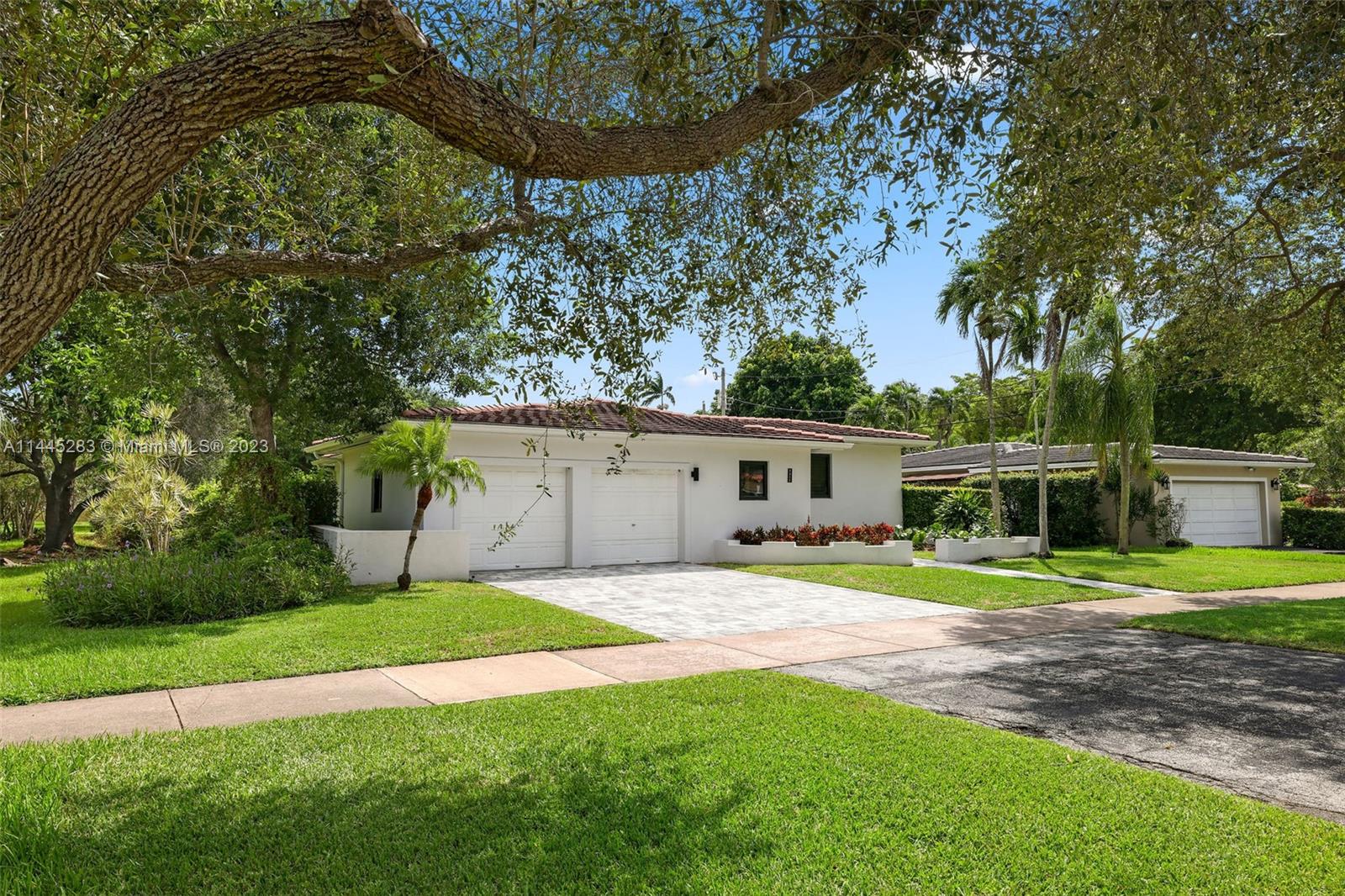 3411 Riviera Drive Coral Gables, FL 33134 - Photo 36 of 38 a house that has a big yard