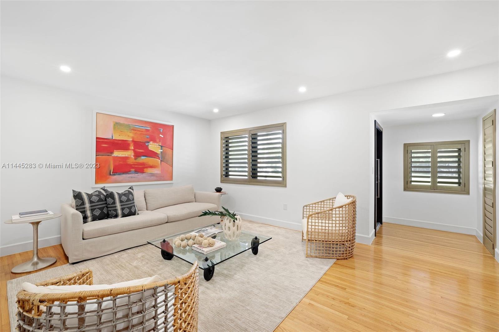 3411 Riviera Drive Coral Gables, FL 33134 - Photo 5 of 38 a living room with furniture and a window