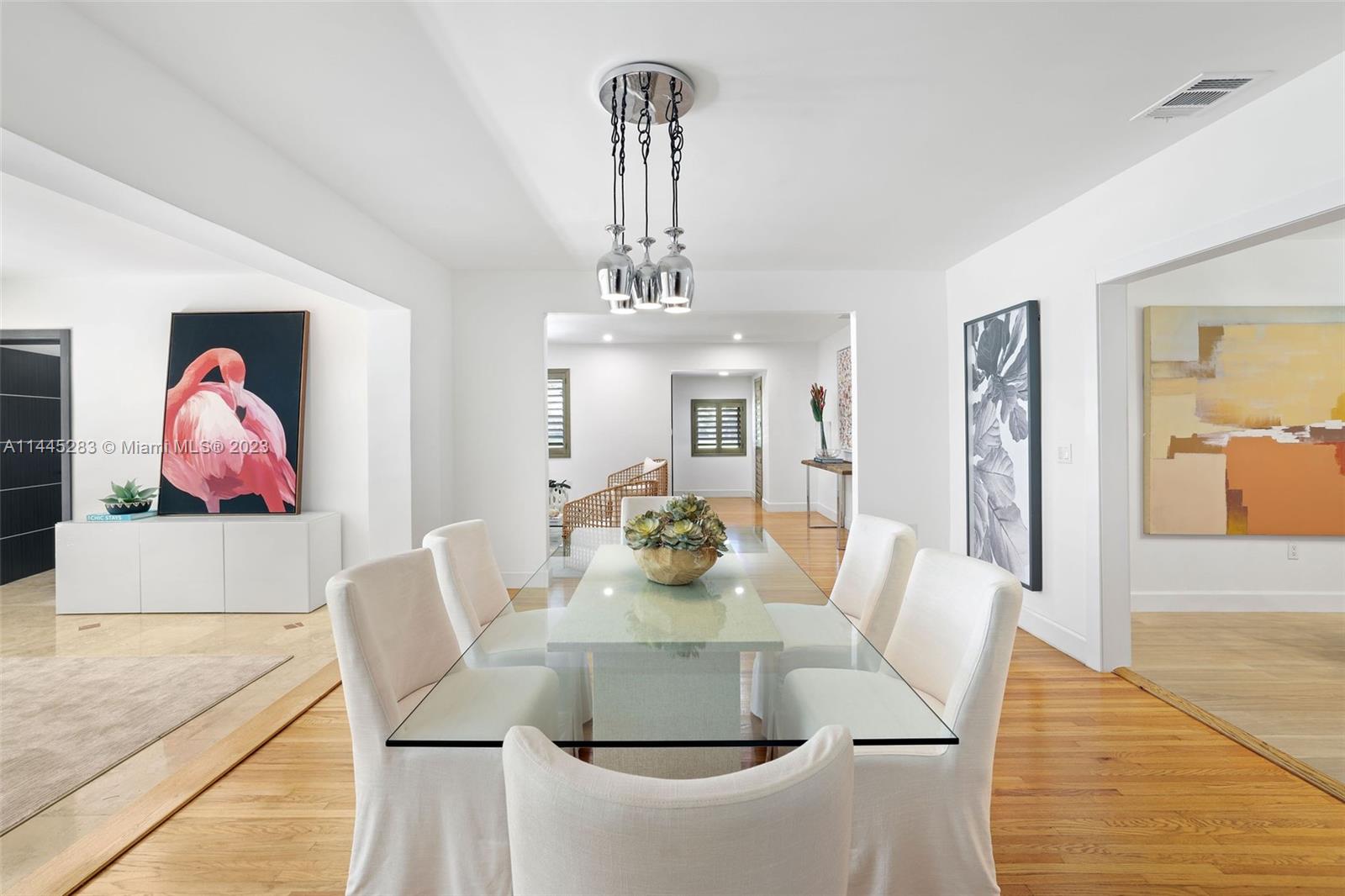 3411 Riviera Drive Coral Gables, FL 33134 - Photo 8 of 38 a view of a dining room with furniture and chandelier