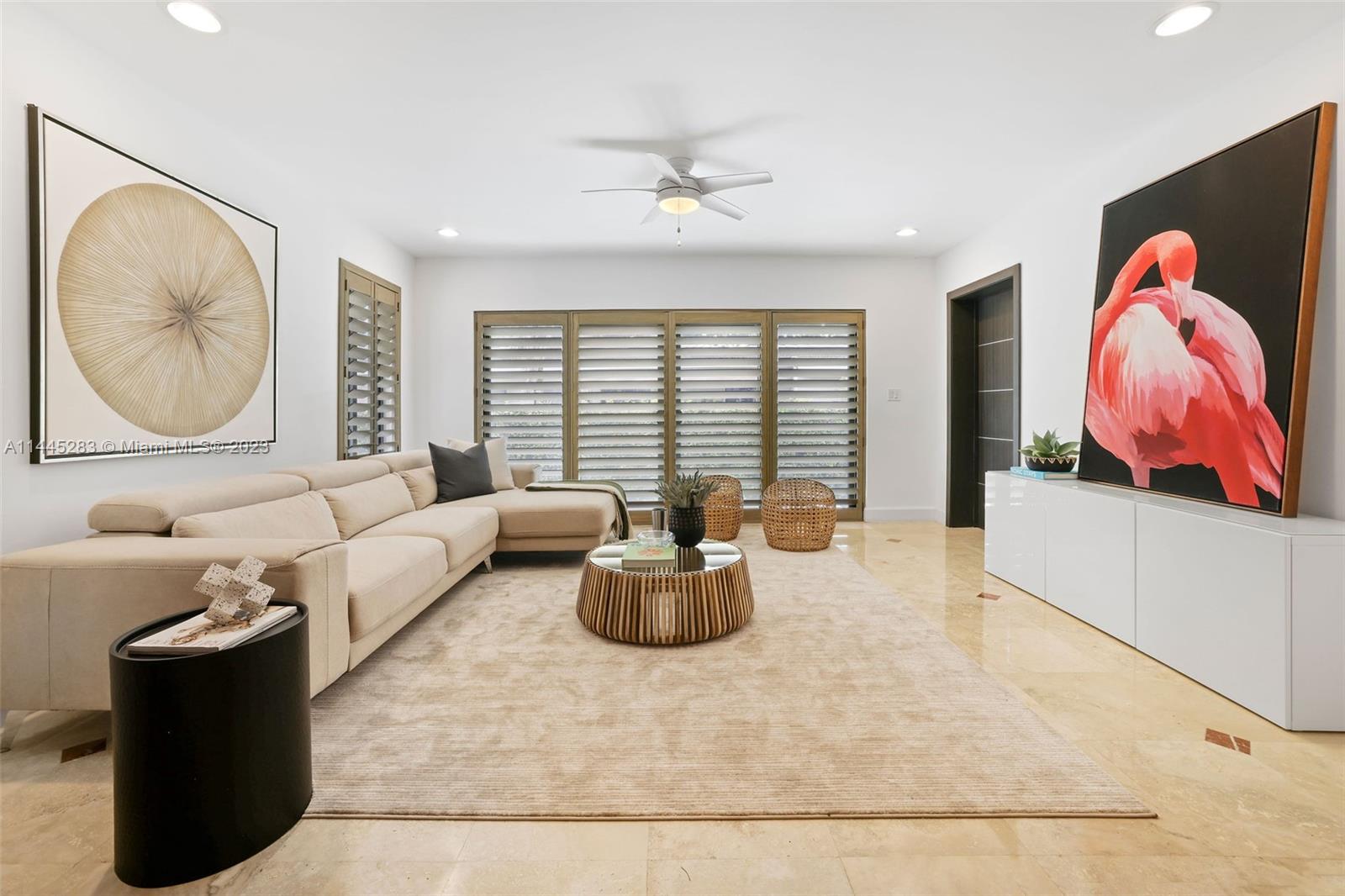 3411 Riviera Drive Coral Gables, FL 33134 - Photo 9 of 38 a living room with furniture and a large window