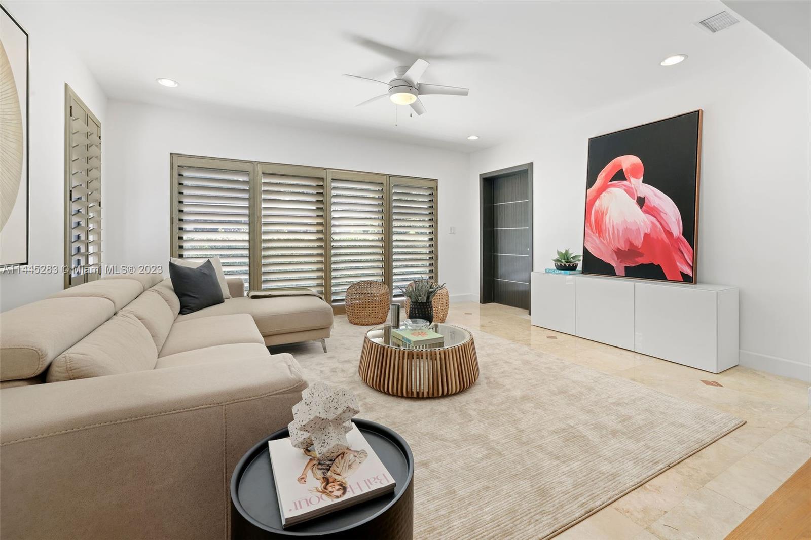 3411 Riviera Drive Coral Gables, FL 33134 - Photo 10 of 38 a living room with furniture and a large window