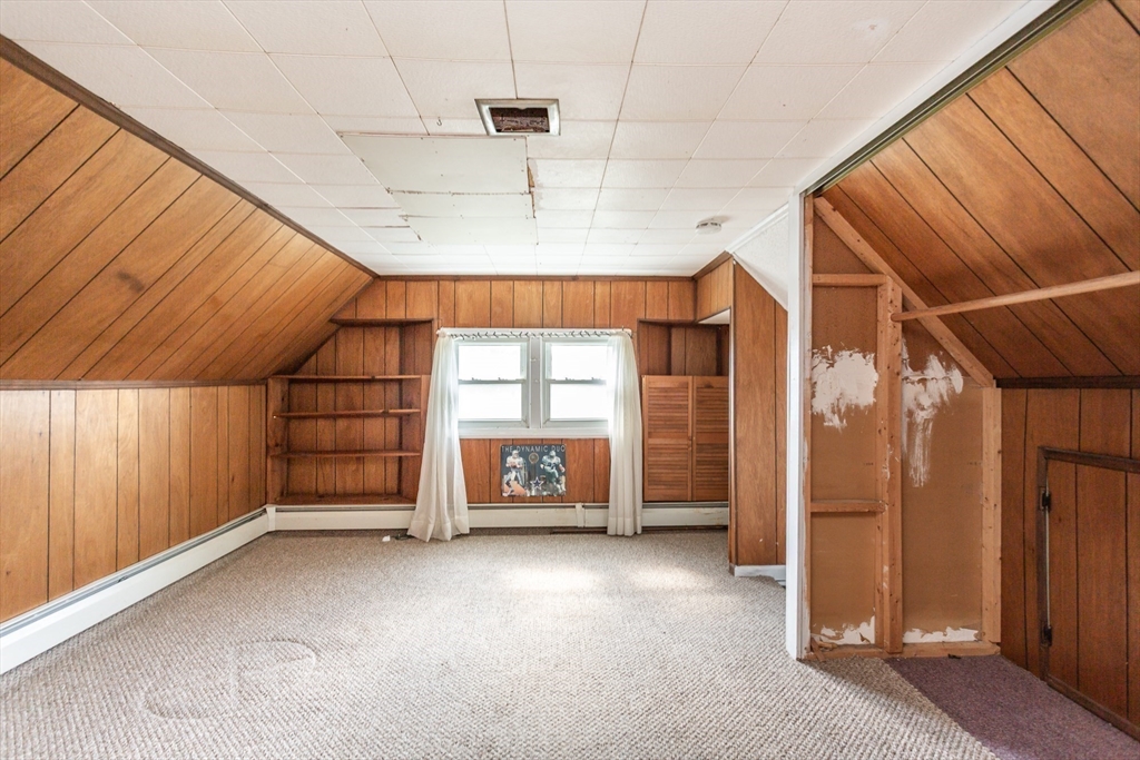 724 High Street Fall River, MA 02720 - Photo 35 of 39 a view of empty room with a fireplace and window