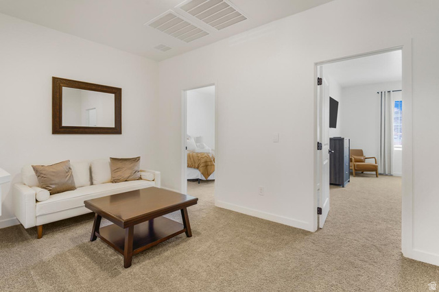 1705 Ripple Rock Drive, Unit 3017 Washington, UT 84780 - Photo 7 of 22 Carpeted secondary living space featuring neutral wall paint, white trim, and recessed lighting
