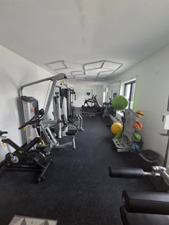 a view of a room with gym equipment