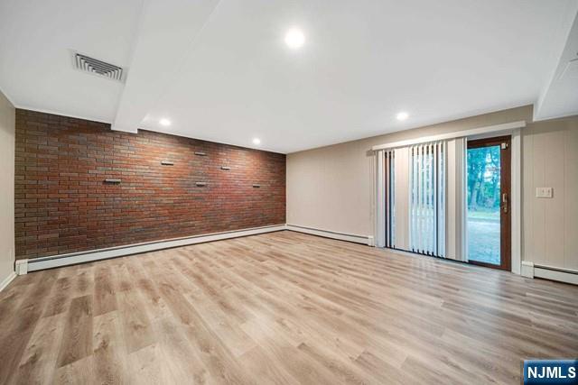 32 Rock Road Englewood Cliffs, NJ 07632 - Photo 25 of 30 a view of an empty room with wooden floor