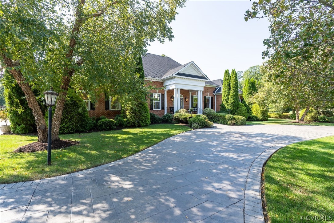 13441 Stonegate Road Midlothian, VA 23113 - Photo 4 of 45 a front view of a house with a yard