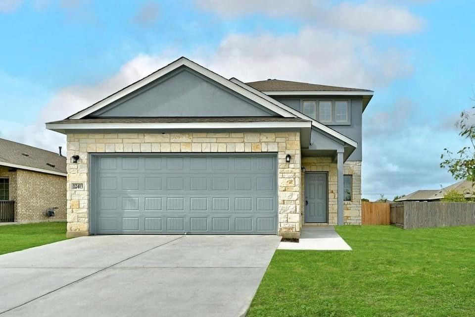 front view of house with a yard