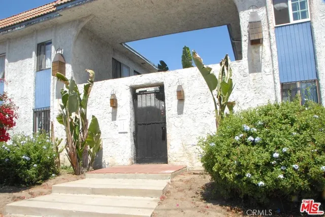 a view of a house with a potted plant
