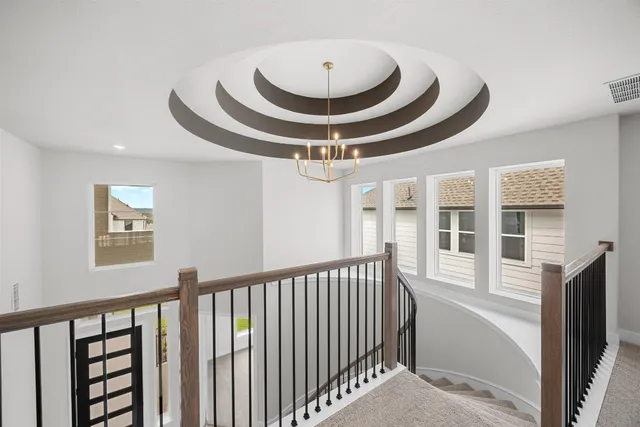 a view of a hallway with windows