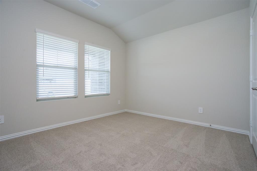 404 Castle Road Sherman, TX 75092 - Photo 20 of 25 an empty room with a window