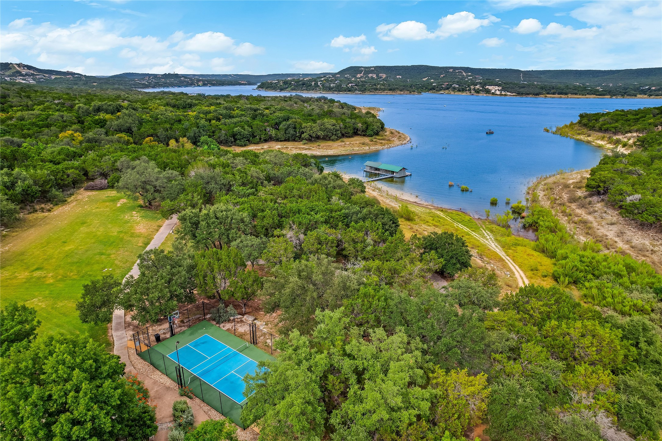 18333 Hidden Ridge Place Lago Vista, TX 78645 - Photo 26 of 40 Pickle Ball at The Beach Club. Walking trails, kayak dock.