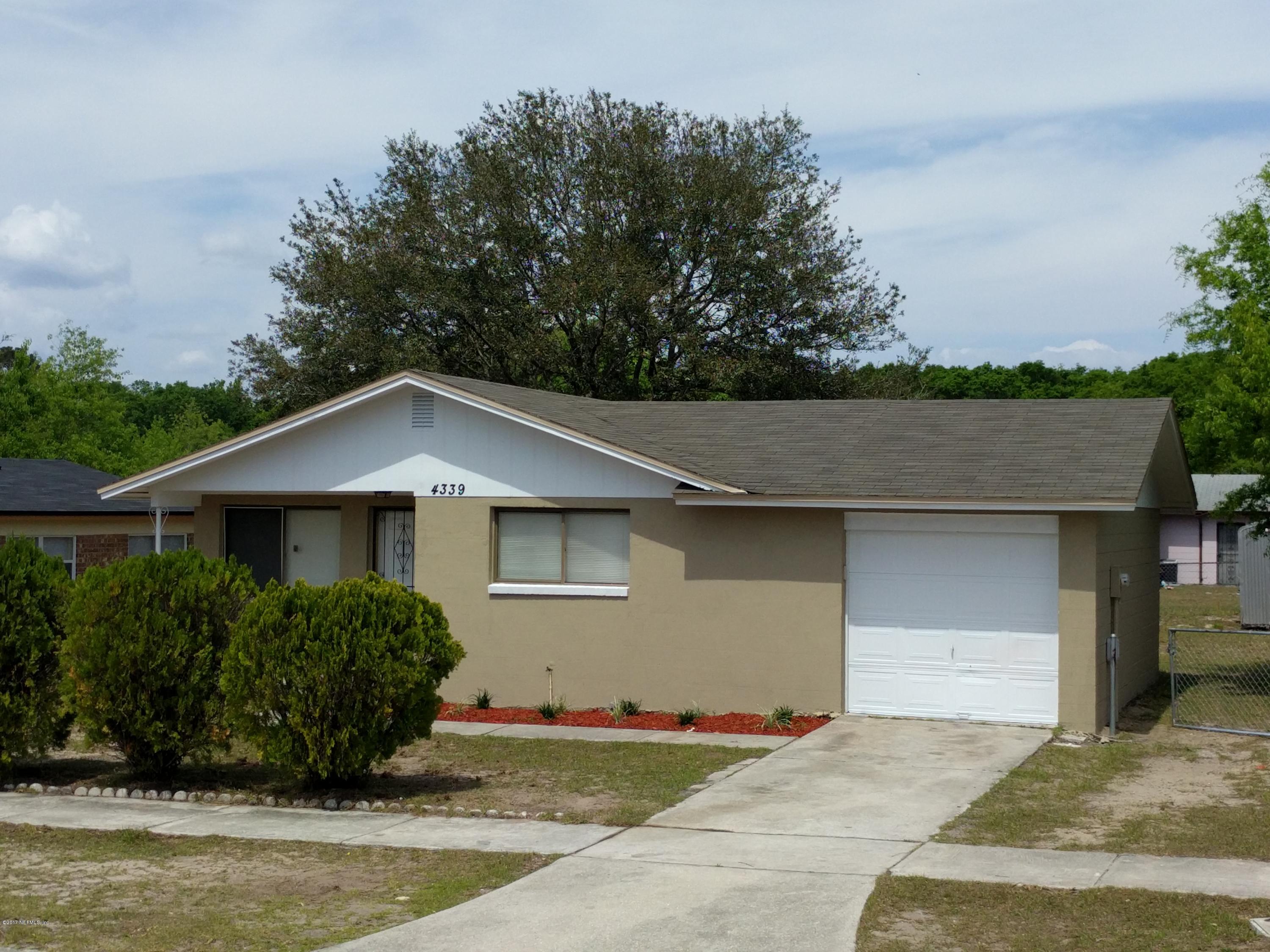4339 Flintshire Road Jacksonville, FL 32208 - Photo 1 of 15 a front view of a house with a garden
