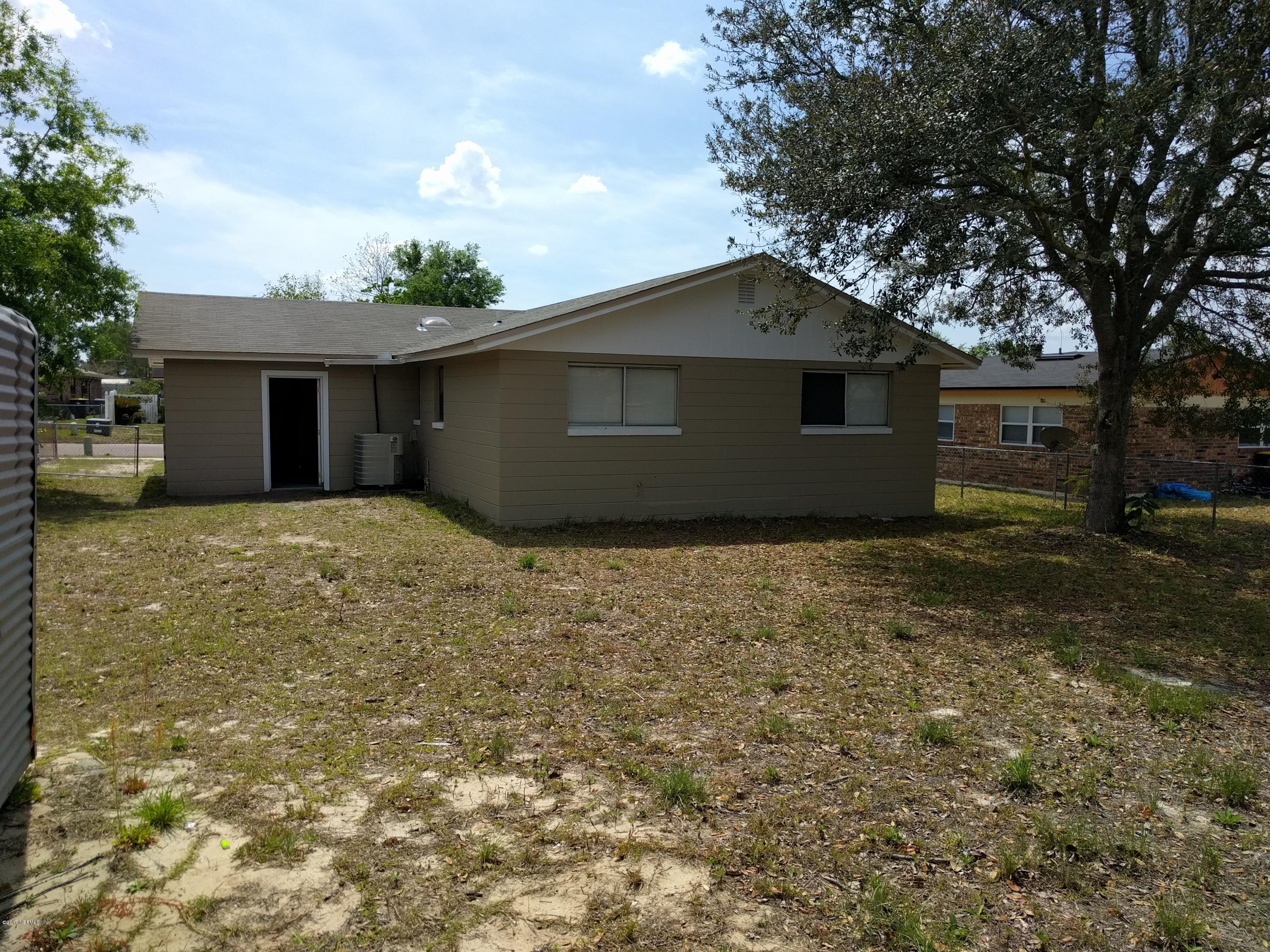 4339 Flintshire Road Jacksonville, FL 32208 - Photo 15 of 15 a backyard of a house with large trees