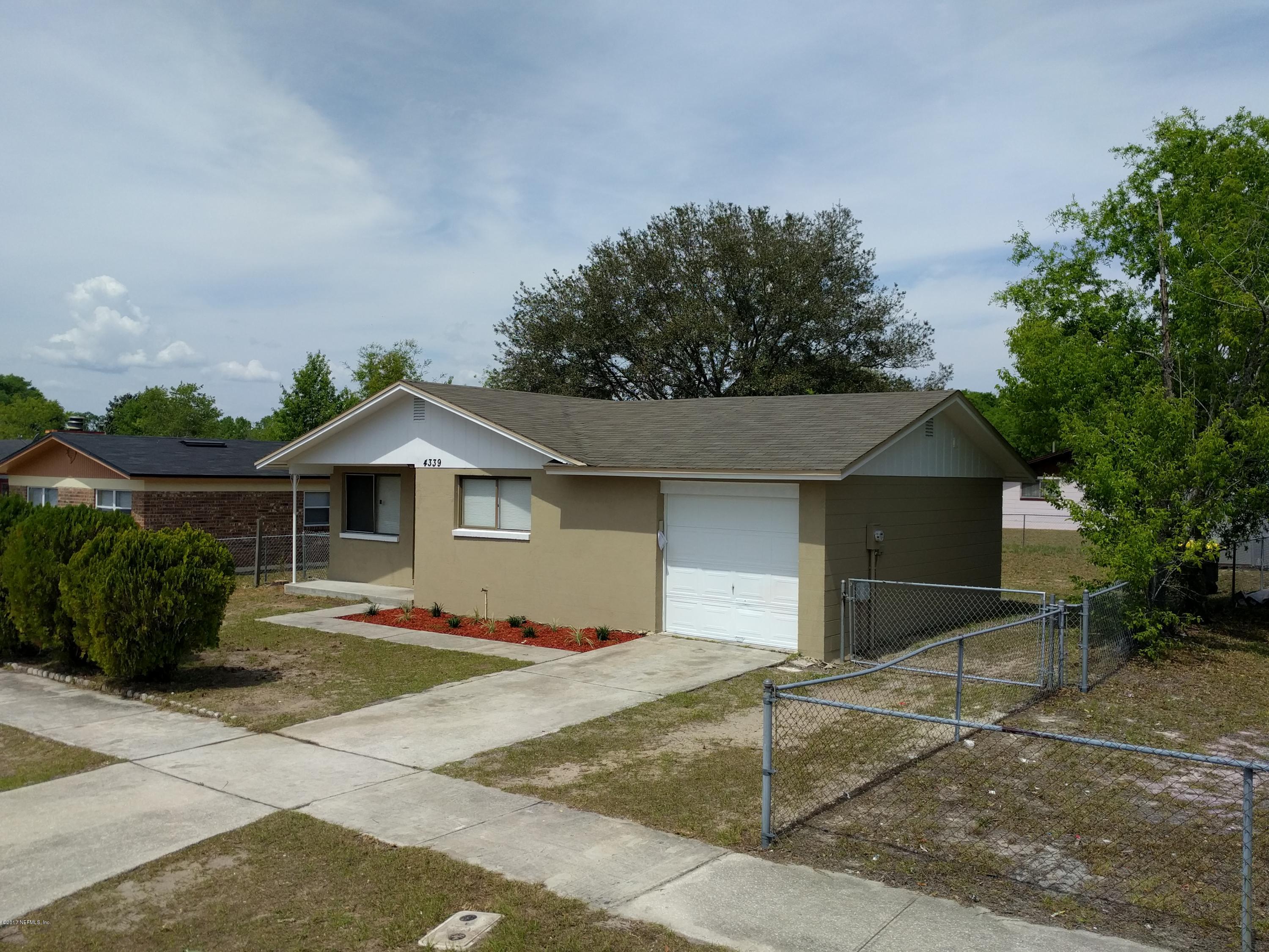 4339 Flintshire Road Jacksonville, FL 32208 - Photo 4 of 15 a front view of a house with a yard