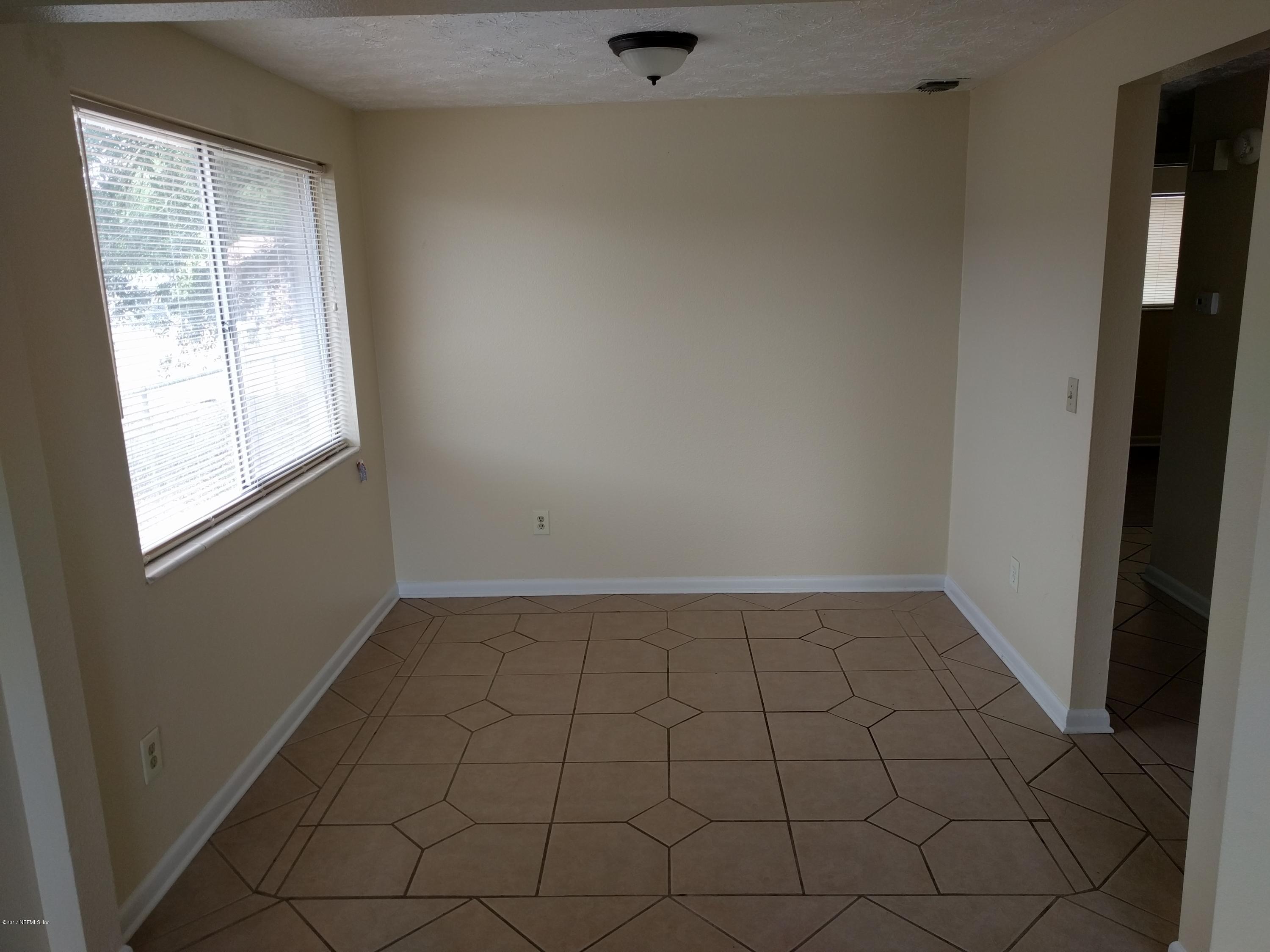 4339 Flintshire Road Jacksonville, FL 32208 - Photo 7 of 15 an empty room with a window