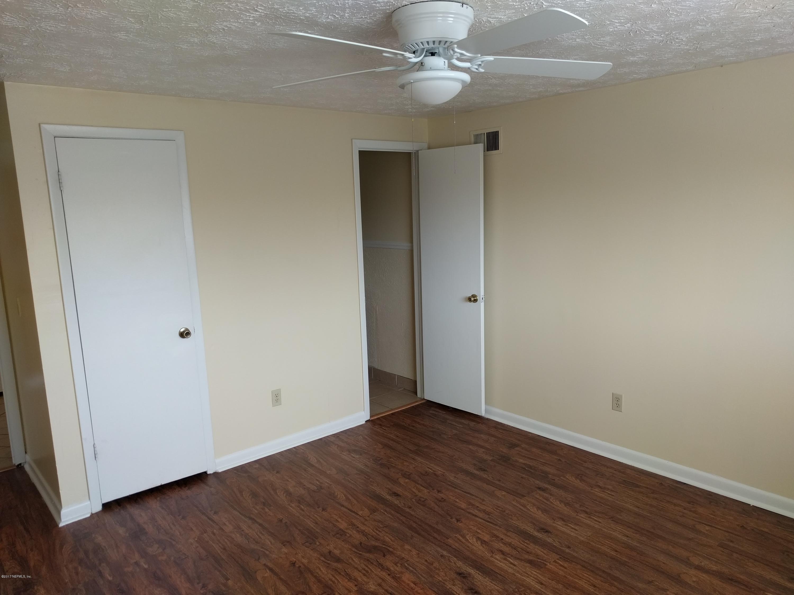 4339 Flintshire Road Jacksonville, FL 32208 - Photo 9 of 15 a view of an empty room with wooden floor