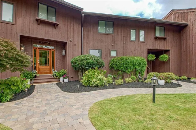 a front view of a house with garden