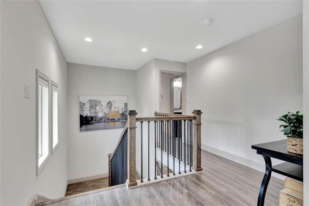4 Northlake Circle Peachtree City, GA 30269 - Photo 18 of 33 a view of a hallway with workspace and wooden floor