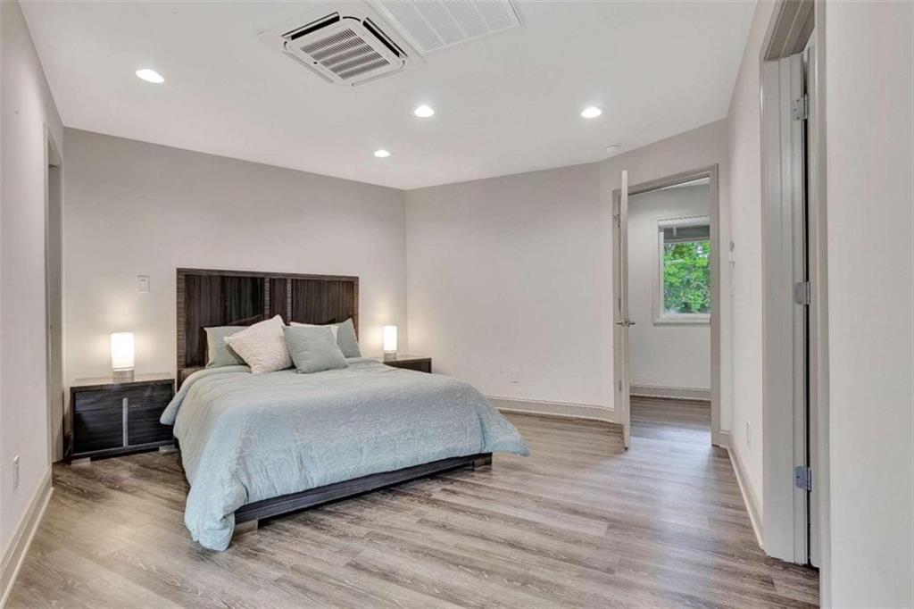 4 Northlake Circle Peachtree City, GA 30269 - Photo 22 of 33 a bedroom with a bed and a night stand