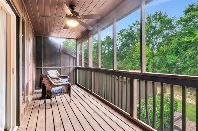 a view of a two chairs in the balcony with wooden floor
