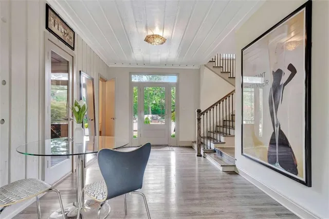 a view of two chairs in the balcony