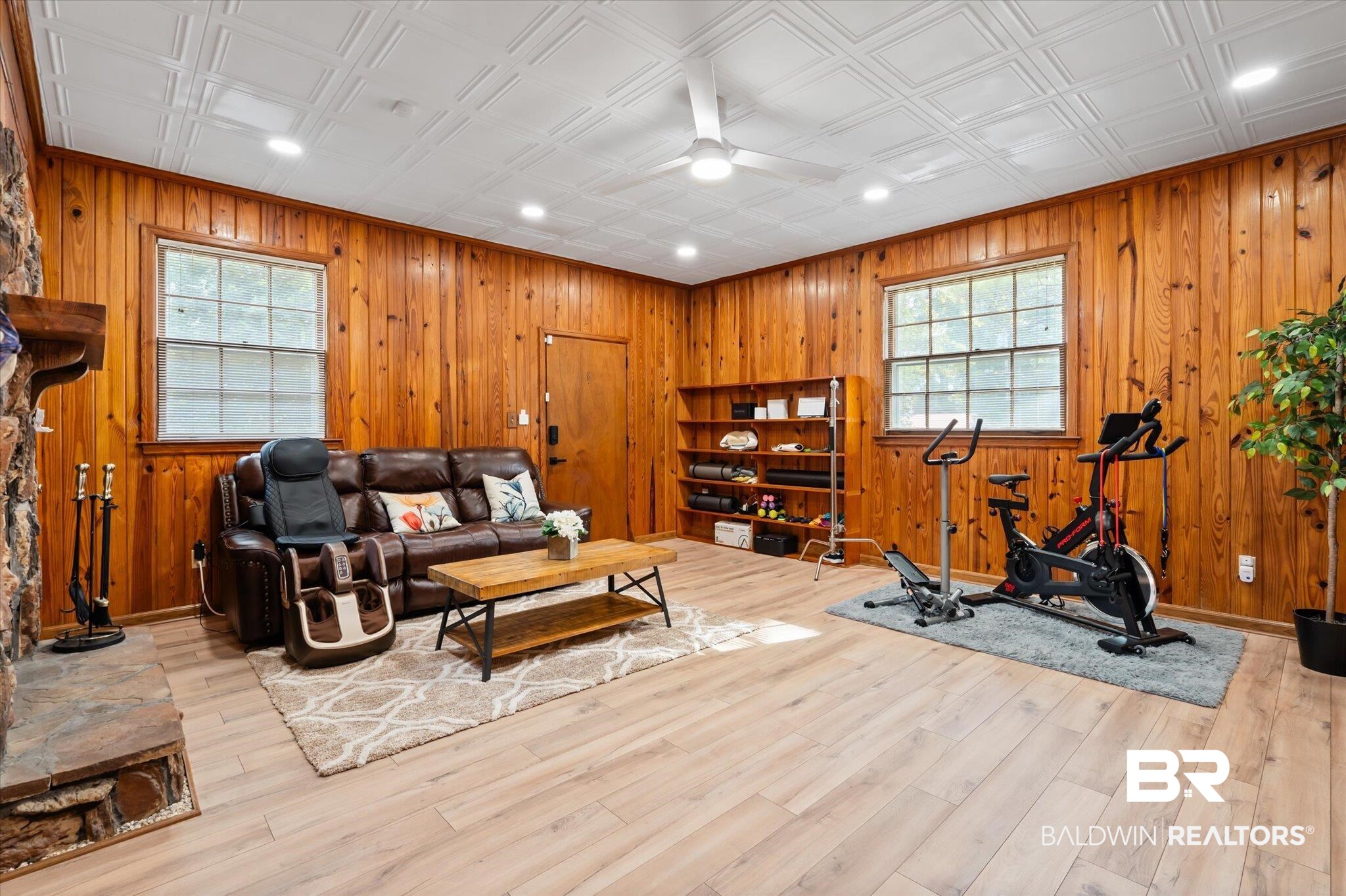 162 Bit And Spur Terrace Mobile, AL 36608 - Photo 8 of 29 Workout room featuring wooden walls, light hardwood / wood-style flooring, and plenty of natural light